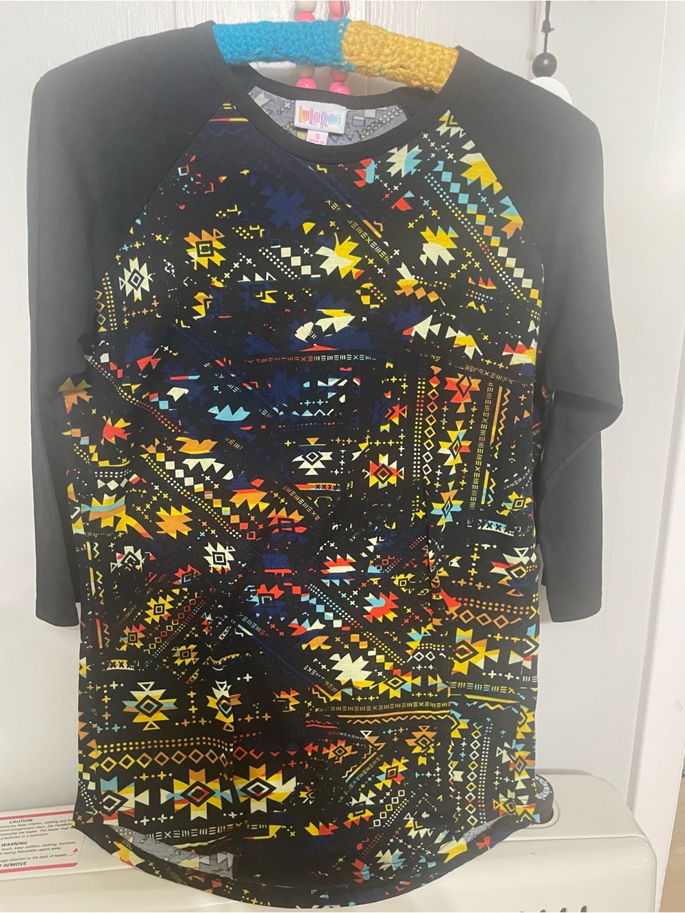 LuLaRoe Black Raglan with Multicolor Southwestern Print